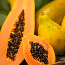 Two sliced open fresh papayas.