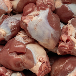 Close up view of raw chicken gizzards.
