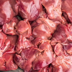 Close up view of raw duck liver and hearts.