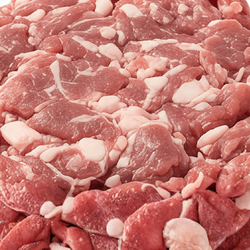 Close up view of raw lamb pieces.